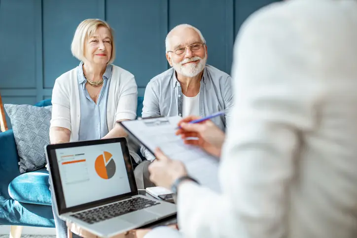 Two seniors consulting Medicare options